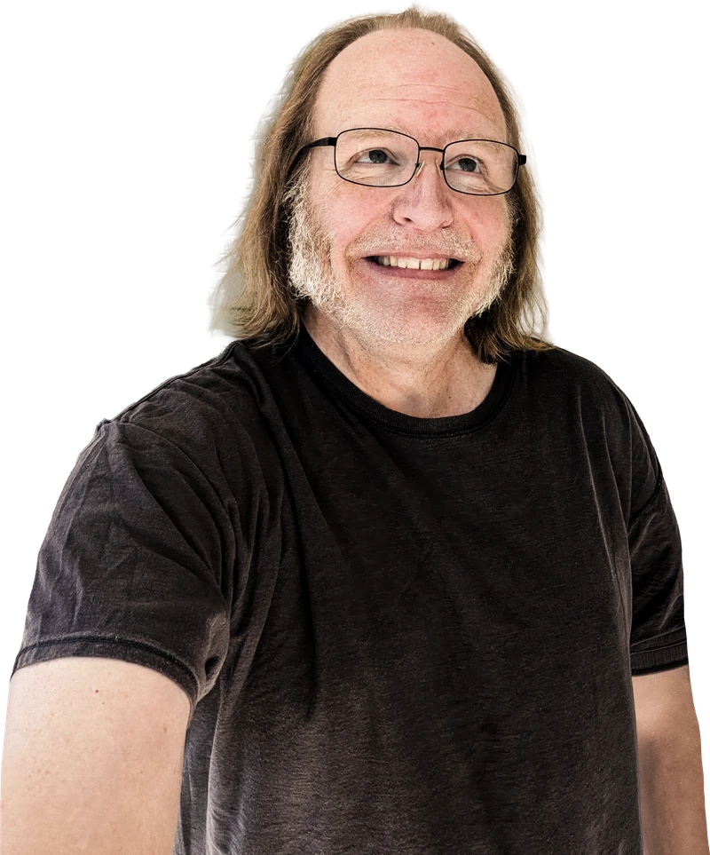 Mike Hughes smiling and looking up toward his contact details
